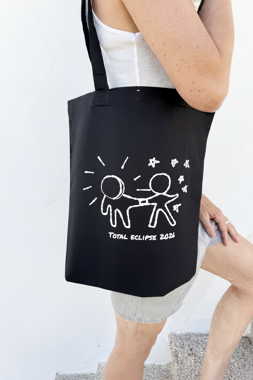 "Kryptos Helios Tote Bag Black — limited edition black cotton tote by LKG Fashion. Inspired by the Total Eclipse 2026. Edition of 23, no re-runs. 38 × 42 cm."